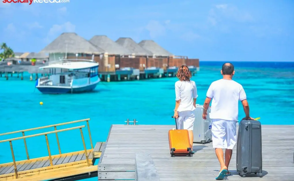 man and woman walks on dock