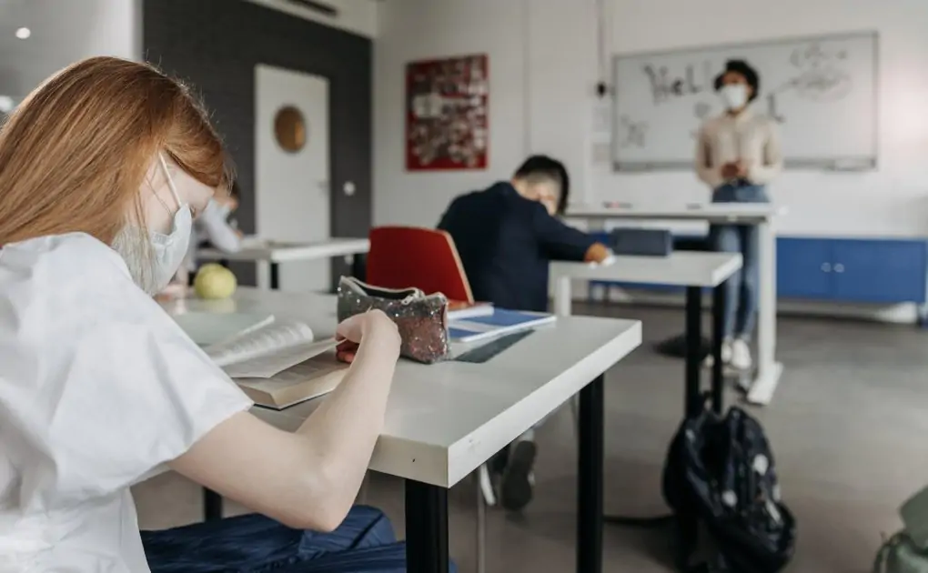 a girl sitting at the desk