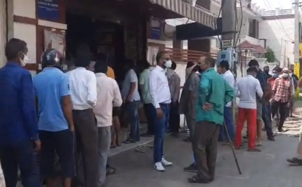 Long line outside the shops due to the opening of liquor shops Socially Keeda