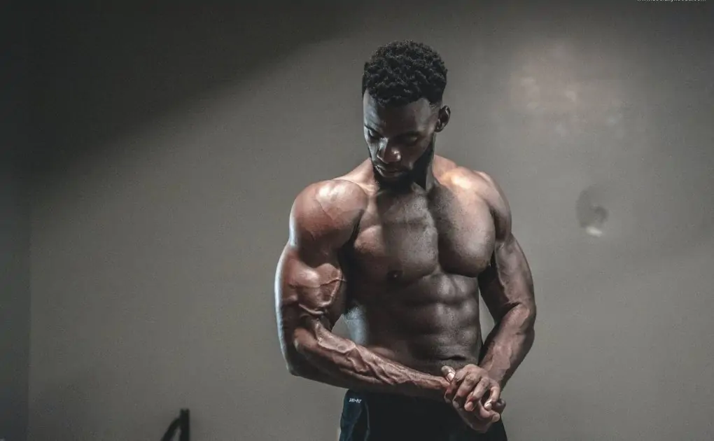 photo of man with muscular body