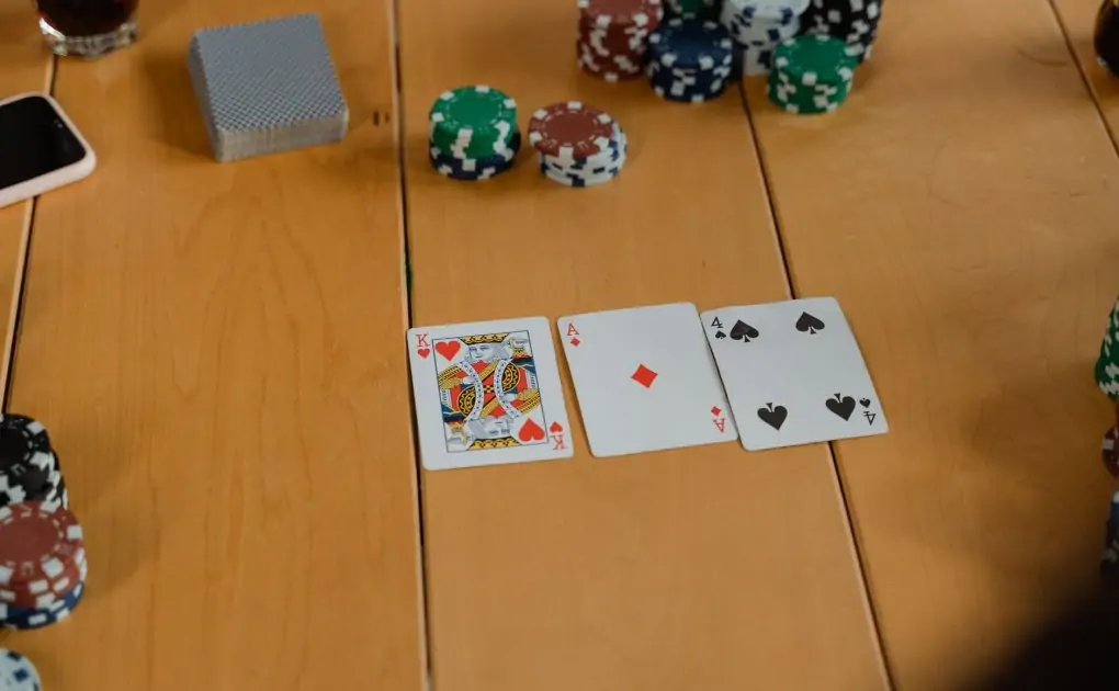 playing cards on brown wooden table