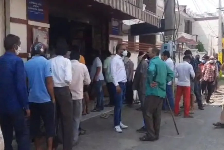 Long line outside the shops due to the opening of liquor shops Socially Keeda