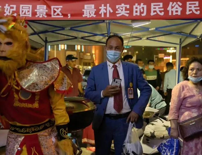 Photos: Patriotic tourism and minders in China’s new Xinjiang