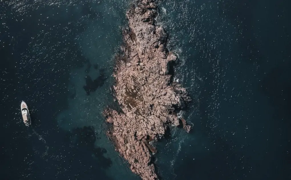 rock island on sea,aerial view photography of island