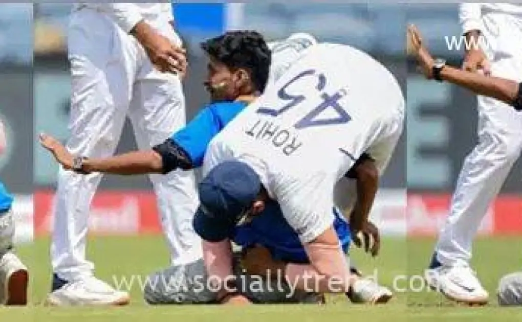 Rohit falls down after a fan tries to touch his feet