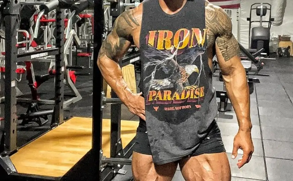 Dwayne 'The Rock' Johnson, 49, shows off INSANELY muscly legs and arms in Iron Paradise vest