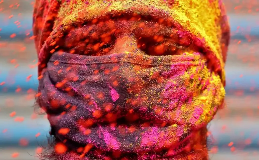 Photos: Indians gather, smear colours for Holi celebrations as virus cases surge