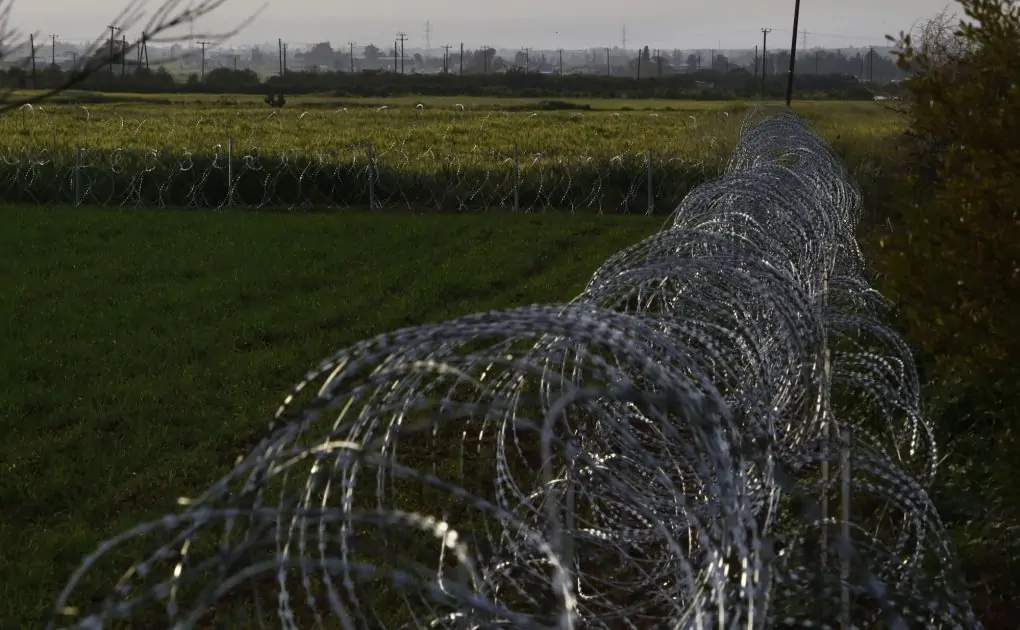 Split Cyprus defends razor wire to halt migrant crossovers