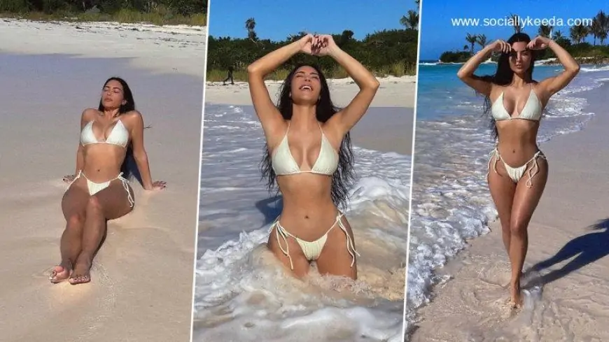 Kim Kardashian Soaks the Sun in a White Bikini As She Enjoys a Day by the Beach (View Pics)