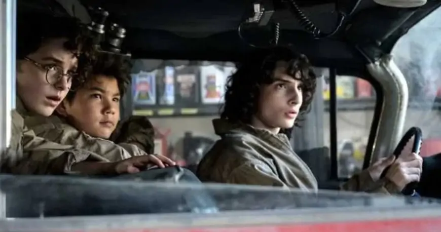 Afterlife Image Takes Ecto-1 for A Spin with Finn Wolfhard