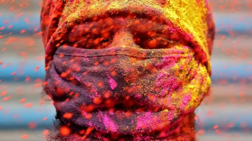 Photos: Indians gather, smear colours for Holi celebrations as virus cases surge