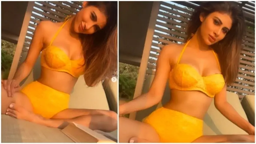 Mouni Roy enjoys her reading time outdoors in bright yellow swimwear