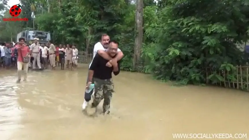 Assam Floods: Sibu Misra, BJP MLA From Lumding Assembly, Takes Piggyback Ride on the Back of a Rescue Worker; Watch Video