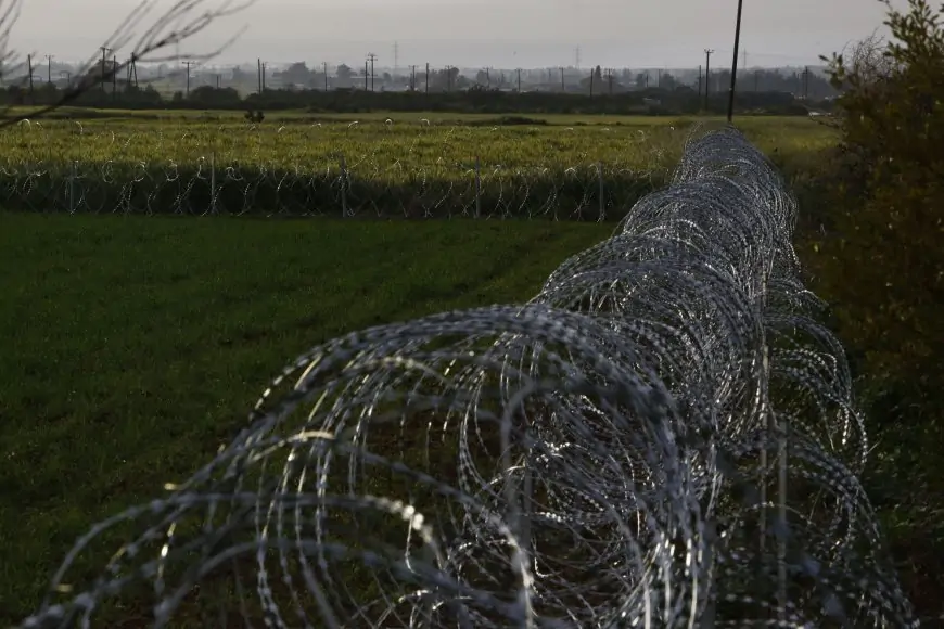 Split Cyprus defends razor wire to halt migrant crossovers