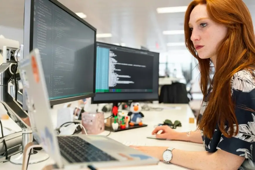 A woman in an office researching RFP on her computer