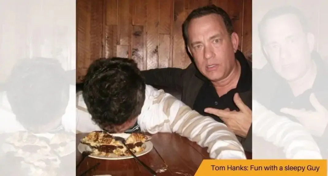 Tom Hanks with a sleepy Guy – photo bomb