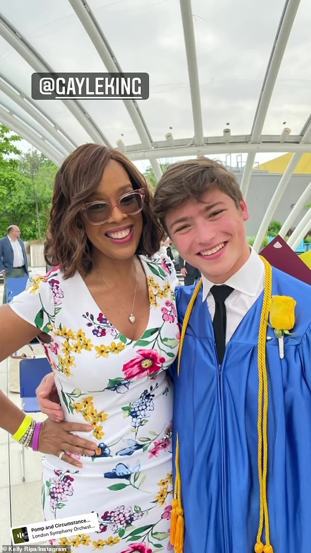 Celebrating the moment: King, who wore a white dress decorated with colorful flowers, posed for a photo with Joaquin as both smiled on the exciting day