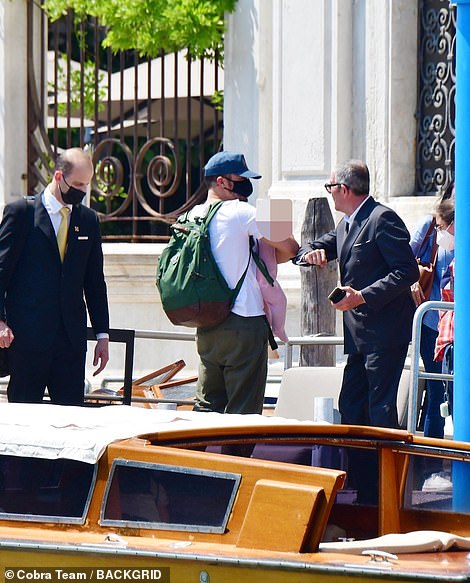 Welcome to Venice: The family were greeted by hotel staff as they walked into the ornate building