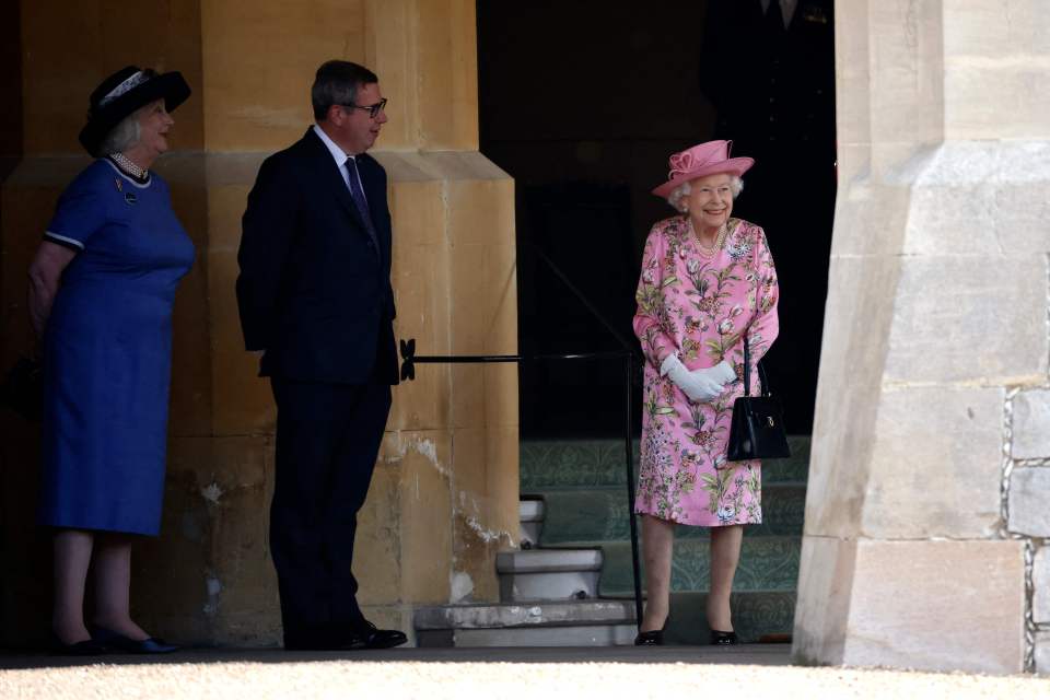 Her Majesty smiled brightly as her guests arrived