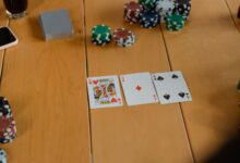 Playing Cards On Brown Wooden Table