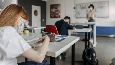 A Girl Sitting At The Desk