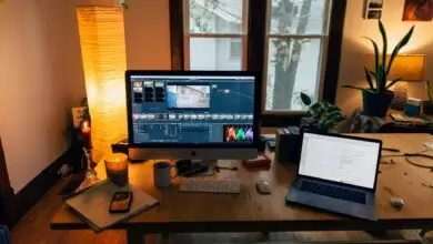 Modern Workplace With Gadgets In Cozy Room With Soft Light